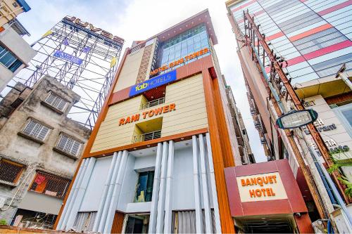 a building with a sign on the front of it at FabHotel Rani Tower - Chinar Park in Kolkata