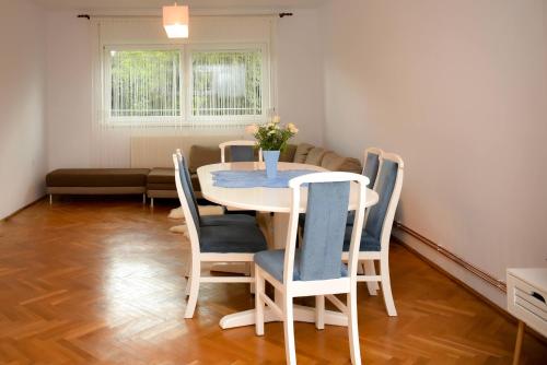 a dining room with a table and chairs at Silent House Sovata in Sovata