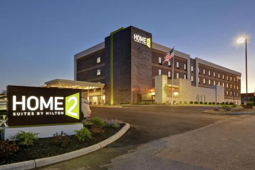 a hotel sign in front of a building at Home2 Suites By Hilton Dayton South in Miamisburg