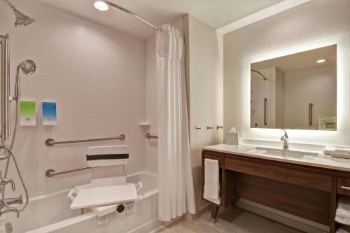 a bathroom with a sink and a shower at Home2 Suites By Hilton Bettendorf Quad Cities in Bettendorf