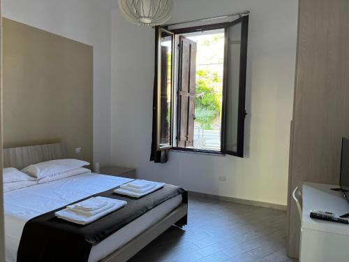 En eller flere senge i et værelse på casavacanze dolcevita