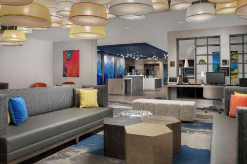 a living room with a couch and a table at Homewood Suites By Hilton Denver Airport Tower Road in Denver