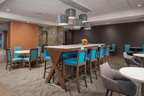 a conference room with a large table and chairs at Hampton Inn & Suites Rapid City Rushmore, SD in Rapid City