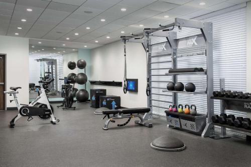 a gym with several machines and weights in a room at Hampton Inn & Suites Rapid City Rushmore, SD in Rapid City