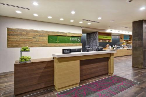 a lobby of a hotel with a reception counter at Home2 Suites By Hilton Birmingham/Fultondale, Al in Fultondale