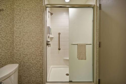 a bathroom with a shower with a glass door at Home2 Suites By Hilton Birmingham/Fultondale, Al in Fultondale
