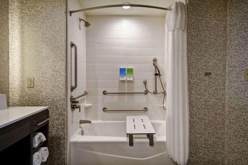 a bathroom with a bath tub and a sink at Home2 Suites By Hilton Birmingham/Fultondale, Al in Fultondale