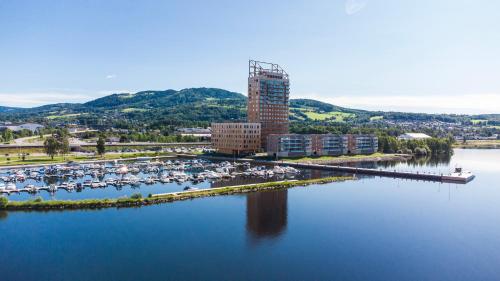 an aerial view of a marina with boats in the water at Wood Hotel by Frich's in Brumunddalen