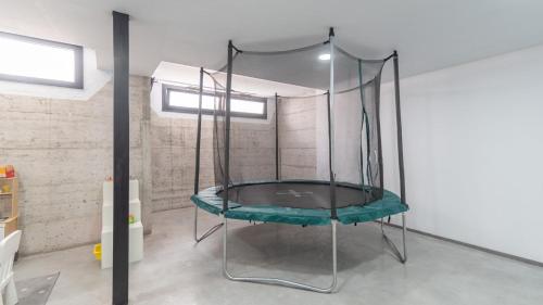 a glass swing in a room at Ramales Alhaurín de la Torre by Ruralidays in Alhaurín de la Torre