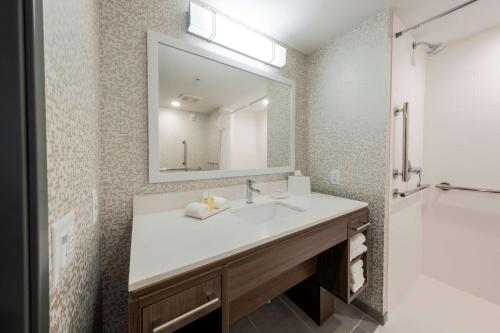 a bathroom with a sink and a mirror at Home2 Suites By Hilton Portland Hillsboro in Hillsboro