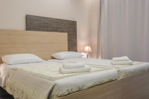 Delfini Beach Hotel & Suitesにあるベッド