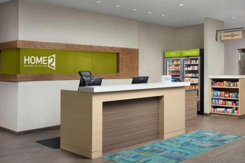 a lobby of a home depot store with a counter at Home2 Suites By Hilton St. Augustine I-95 in Saint Augustine
