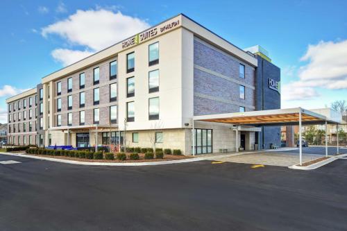 a building with a parking lot in front of it at Home2 Suites By Hilton Taylor Detroit in Taylor