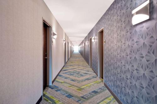 a corridor of a hospital hallway with a carpeted hallway at Home2 Suites By Hilton Taylor Detroit in Taylor