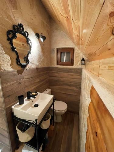 a bathroom with a sink and a toilet at NV Mountain House in Žabljak