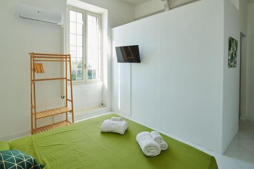 Ένα ή περισσότερα κρεβάτια σε δωμάτιο στο [Gioiello a due passi da Ortigia]private parking