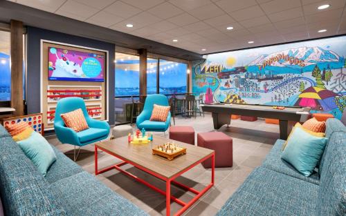 a gaming room with a pool table and a mural at Tru By Hilton Lehi, Ut in Lehi