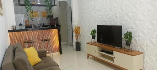 TV o dispositivi per l'intrattenimento presso Casa jardim para temporada em Piranhas-Alagoas