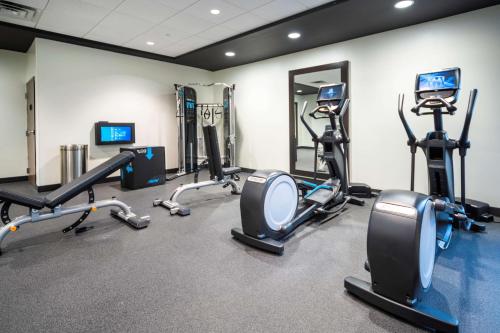 a gym with several treadmills and cardio machines at Home2 Suites By Hilton Minneapolis-Mall of America in Bloomington