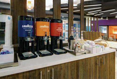 a counter with several bottles of wine on it at Tru By Hilton Austin Airport, Tx in Austin