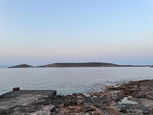 a large body of water with islands in the distance at Diakofti house by the sea in Kýthira