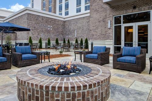 a fire pit in the middle of a patio at Homewood Suites By Hilton Summerville in Summerville