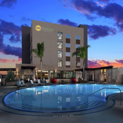 a large swimming pool in front of a hotel at SunCoast Hotel Anaheim, Tapestry Collection by Hilton in Anaheim
