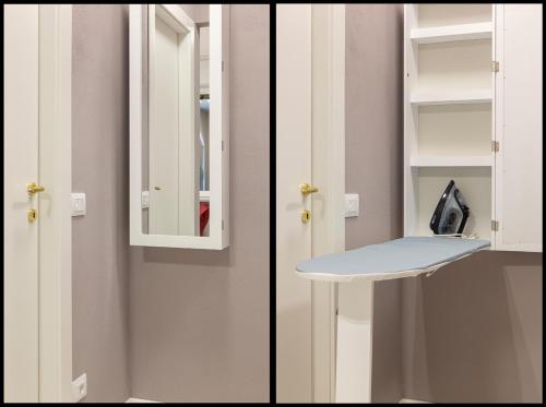 a bathroom with a white cabinet and a sink at Emerald Suites in Stresa