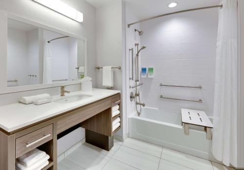 a white bathroom with a sink and a shower at Home2 Suites By Hilton Euless Dfw West, Tx in Euless