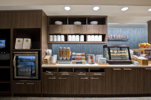 a food counter in a restaurant with a food cart at Home2 Suites By Hilton Lewisville Dallas in Lewisville