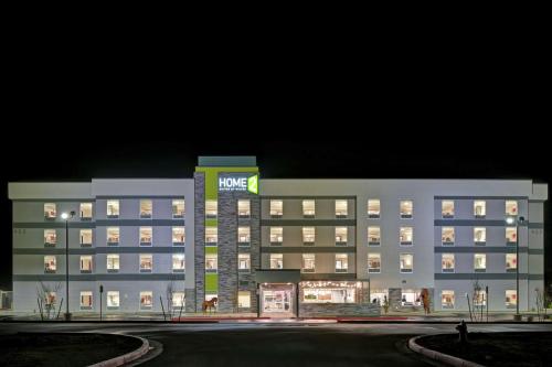 a large white building with a sign on it at Home2 Suites By Hilton Buckeye Phoenix in Buckeye
