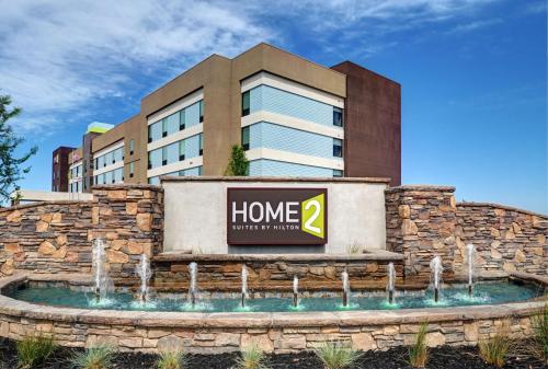 a home hotel sign in front of a building at Home2 Suites By Hilton Tracy, Ca in Tracy