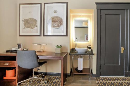 a home office with a desk and a sink at The Peery Salt Lake City Downtown, Tapestry Collection by Hilton in Salt Lake City