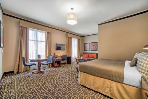a hotel room with a bed and a desk at The Peery Salt Lake City Downtown, Tapestry Collection by Hilton in Salt Lake City