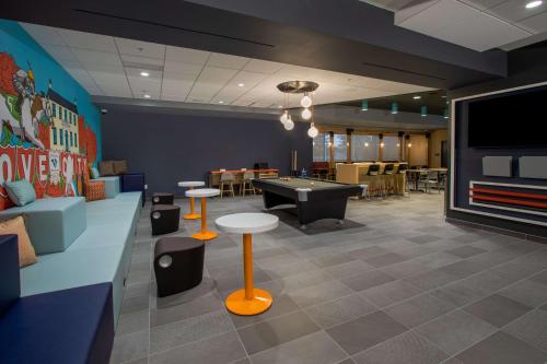 a gaming room with a pool table and ping pong ball at Tru By Hilton Grove City Columbus in Grove City