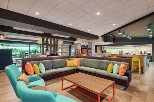 a living room with a couch and a coffee table at Tru By Hilton Ringgold, Ga in Ringgold