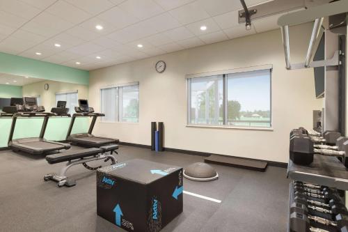 a gym with treadmills and machines in a room at Tru By Hilton Ringgold, Ga in Ringgold