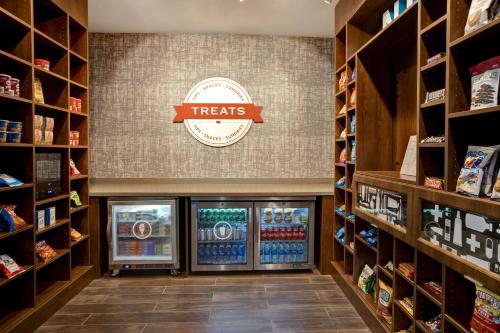 a grocery store with a treats sign on the wall at Hampton Inn & Suites Deptford, Nj in Deptford