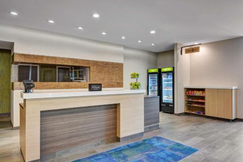 a restaurant lobby with a counter and a drink at Home2 Suites By Hilton Fort Mill, Sc in Fort Mill