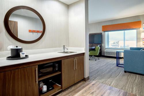 a bathroom with a sink and a mirror at Hampton Inn & Suites Indio, Ca in Indio