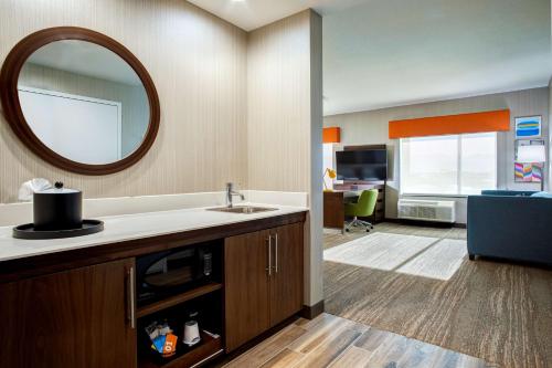 a bathroom with a sink and a mirror at Hampton Inn & Suites Indio, Ca in Indio