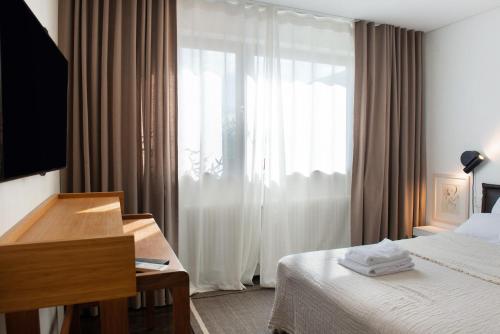 Ένα ή περισσότερα κρεβάτια σε δωμάτιο στο Domicile Relax