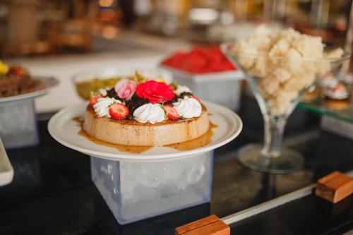 a dessert on a plate on a table at Transamerica Comandatuba - All Inclusive Resort in Ilha de Comandatuba