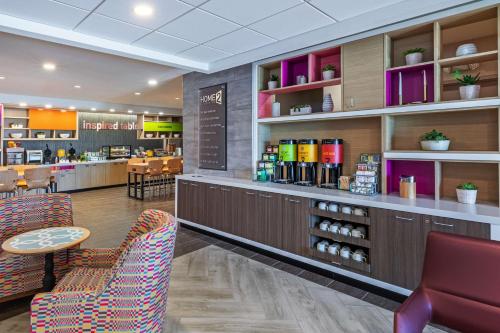 a lobby of a store with chairs and a counter at Home2 Suites by Hilton Laredo, TX in Laredo