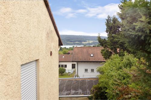 a view of a house with a garage at Boutique Apartment Anybody in Gaienhofen