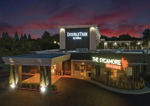 a building with a sign on it at night at Doubletree By Hilton Chico, Ca in Chico