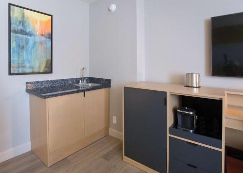 a bathroom with a sink and a counter with a tv at Doubletree By Hilton Chico, Ca in Chico