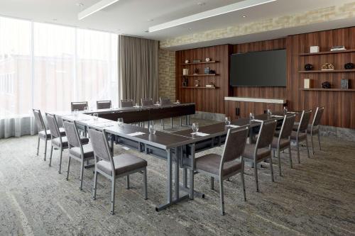 a conference room with a long table and chairs at Homewood Suites By Hilton Montreal Midtown in Montréal