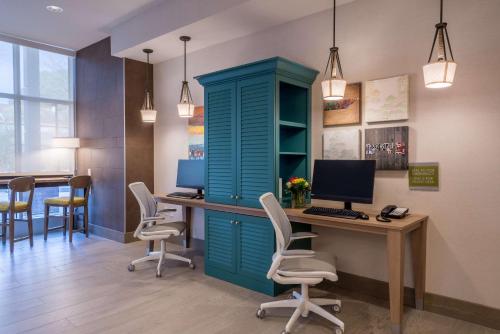 an office with a blue cabinet and a desk with a computer at Home2 Suites By Hilton Memphis East / Germantown, Tn in Memphis