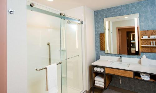 a bathroom with a shower and a sink at Hilton Garden Inn Moncton Downtown, Nb in Moncton